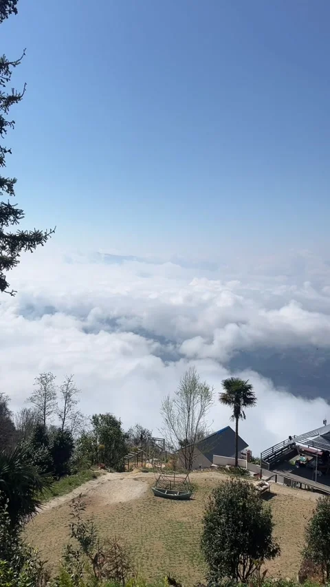 High-Angle Time-lapse of Rolling Sea of Clouds Above Mountain Resort Vídeos de archivo 329141554