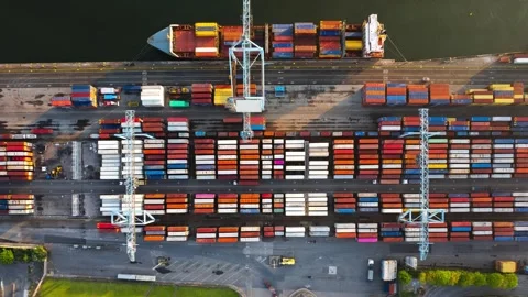 High Angle Timelapse of Container Cranes Loading Freight Ship at Irish Terminal Stock Footage 344909360