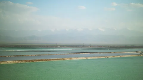 High-Angle Top-Down Aerial View of Mangya Emerald Lake and Kunlun Mountains Stock Footage 343799403