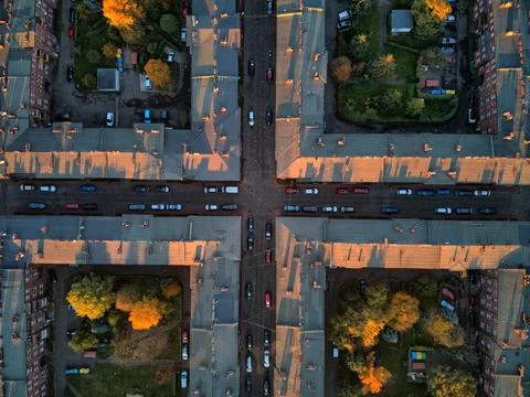 High angle top-down view of street intersection and red brick housing blocks  Stock Photos