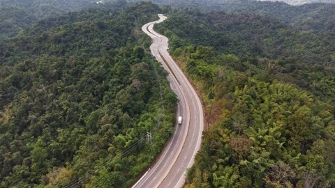 High-Angle Top View of an Elegant S-Curve Mountain Road Stock Footage 327507877