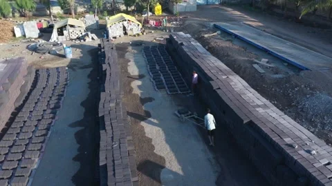 High angle tracking drone perspective looking down a long central pathway inside Stock Footage 337789808