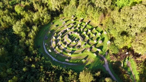 High-Angle Tracking Shot of the 81-Stone Spiral Landmark in the the Highlands Stock Footage 330667585