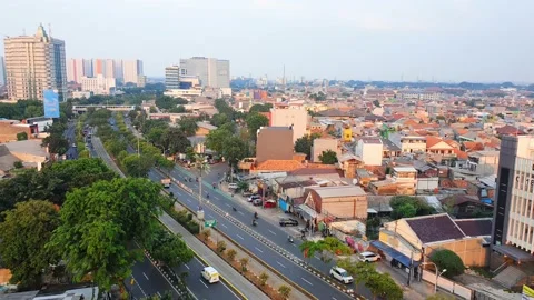 High angle traffic and building in urban city jakarta with blue sky and cloud Stock Footage 216588336