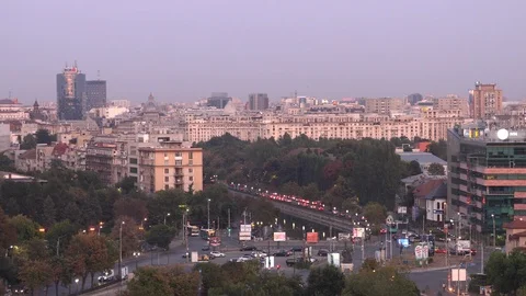 High angle of traffic by the river in Bucharest at dusk Stock Footage 120539237