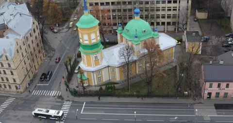 High-angle urban view in Riga: an Orthodox church near a busy crossroads Stock Footage 320169951