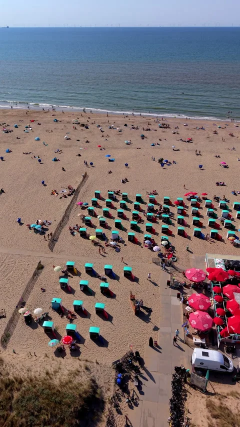 High angle vertical aerial drone video clip of sandy beach with beach chair Stock Footage 342634912