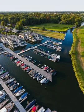 High angle vertical aerial drone photograph of marina, floating wooden pier Stock Photos
