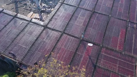 High angle vertical drone overview tracking slowly across a broad structural Stock Footage 337790040