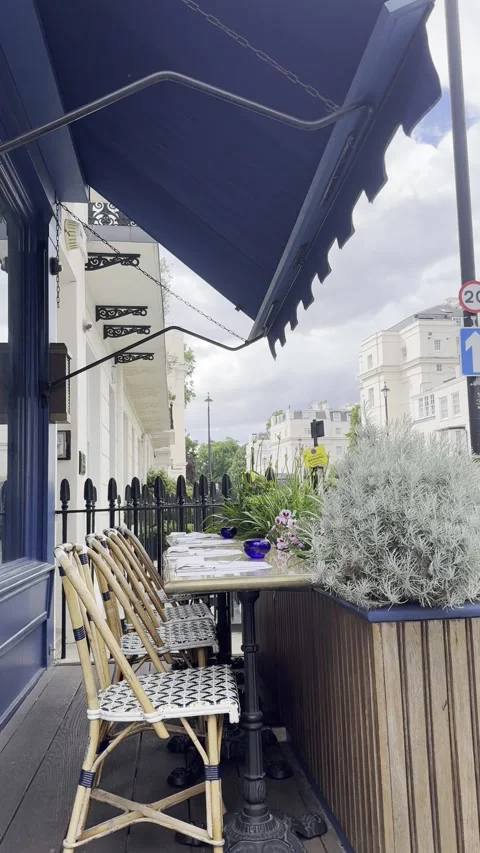 High angle vertical shot of empty outdoor cafe tables in Belgravia London Stock Footage 336680151