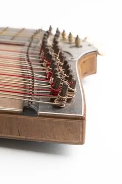 High angle vertical studio shot of vintage, old wooden zither isolated on white Stock Photos