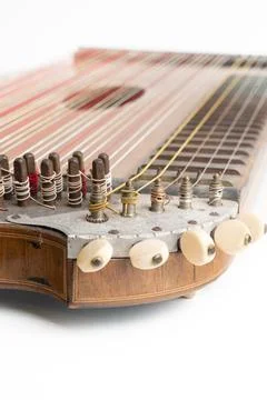 High angle vertical studio shot of vintage, old wooden zither isolated on white Stock Photos