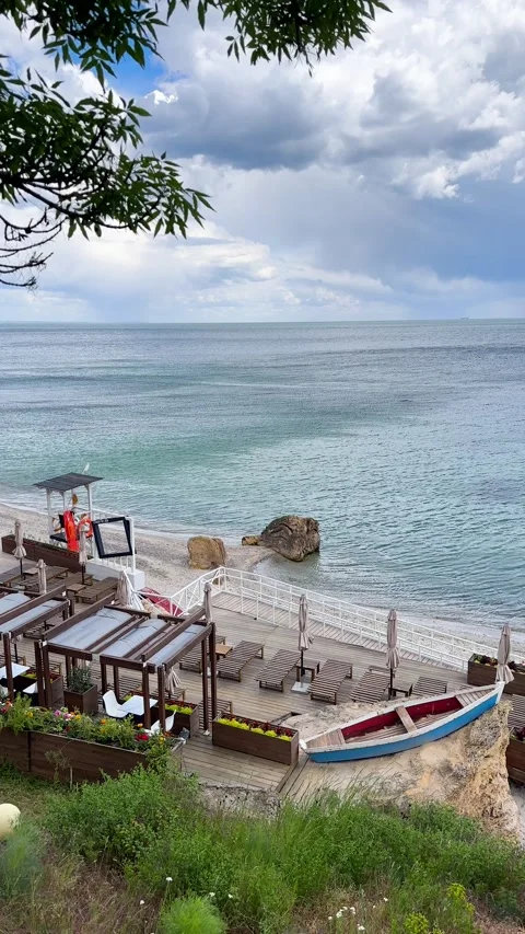 High angle vertical view of a luxury beach club with a wooden deck Stock Footage 335885640