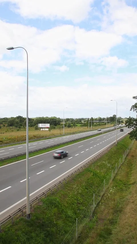 High angle vertical view of traffic on a modern multi-lane highway. Cars an.. Vídeos de archivo 336203179