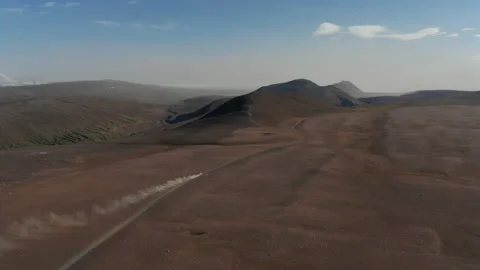 High angle view 4x4 off road vehicle driving rock desert in Iceland. Amazing Stock Footage 167376214