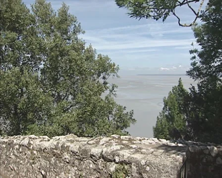 High angle view from the abbey of Mont Saint-Michel at the surrounding bay + pan Stock Footage 45966626