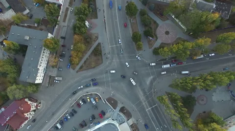 A high angle view of an almost empty street intersection, with yellow cross walk Stock Footage 57621904