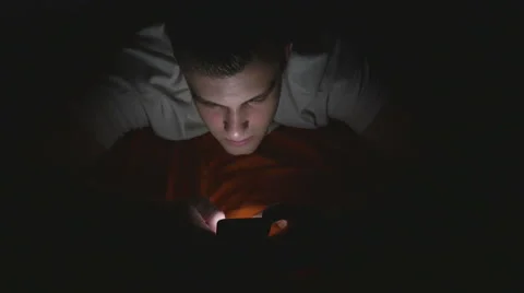 High angle view of an attractive young man using a smart phone in bed Video stock 61633603