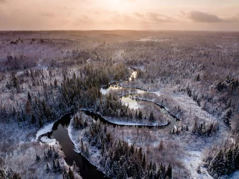 High angle view of aunrise over a winding creek in winter Stock-Fotos
