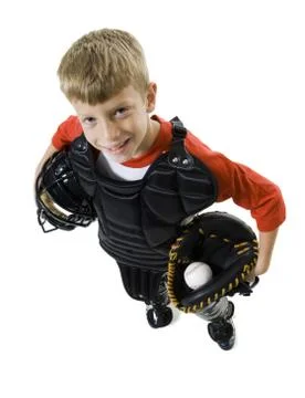 High angle view of a baseball catcher holding a baseball helmet and a catchers Stock Photos