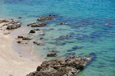 High angle view of beautiful beach and rocks Stock Photos