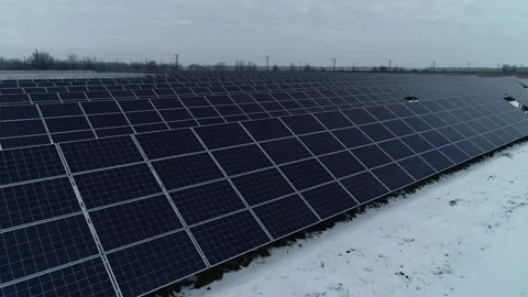 High angle view of the beautiful fields covered in snow and solar power station Stock Footage 160811002
