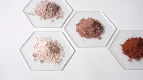 High-angle view of beige and brown powders on glass Stock Footage 343044131