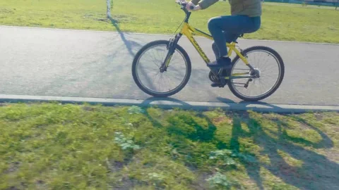 High angle view of bicycle wheel on the concrete road Video stock 95706551