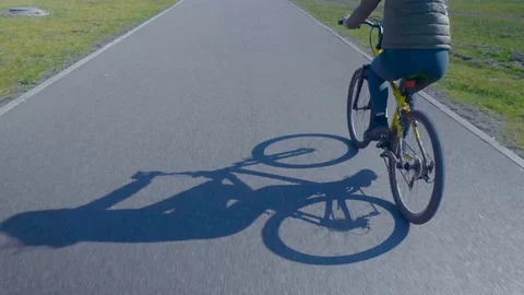 High angle view of bicycle wheel on the concrete road Stock Footage 95706648