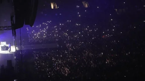 High-angle view of a big cheering crowd at a big concert event in Paris Stock Footage 242448694