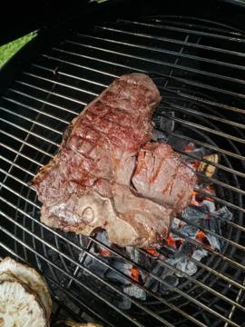 High angle view of big grilled porterhouse steak with griddle marks lying on  스톡 사진
