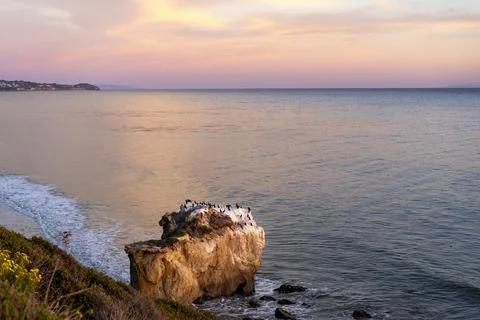 High angle view of a big rock formation at sunset at El Matador Beach, Cali.. Stock Photos