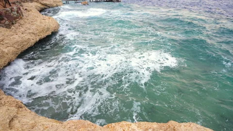 High angle view of big waves breaking on the shore with sea foam. Nature Stock Footage 149440578