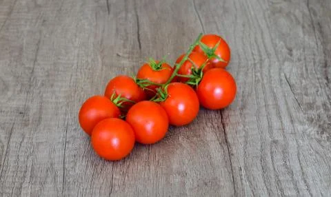 High angle view of bio cherry tomatoes  clusters on table. Stock Photos