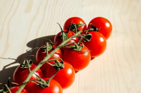 High angle view of bio cherry tomatoes  clusters on table. Foto stock