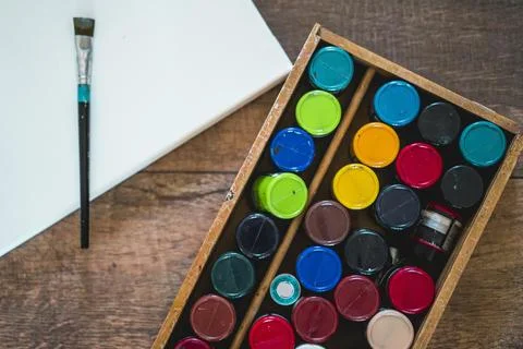 High angle view of a blank canvas acrylics and other elements of a painter Fotos Stock