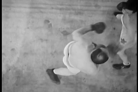 High angle view of boxer knocking out opponent, 1930s Stock Footage 35328006