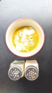 High angle view. The breakfast menu consists of half-cooked eggs on the table Stock Photos