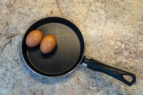 High Angle View of Brown Eggs in Frying Pan 스톡 사진