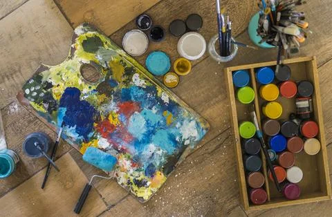 High angle view of brushes, pallete, oils, acrylics and other elements of a.. Stock Photos