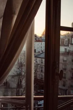 High angle view of buildings seen through window during sunset Foto stock