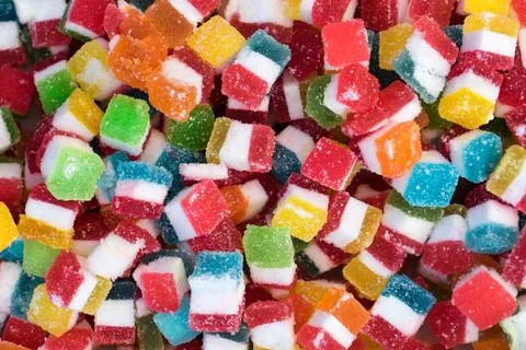 High Angle View of the Bulk of Colorful Gummy Jelly Candy Cubes Foto stock