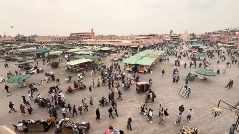 High angle view of the bustling Jemaa El-Fnaa market square with crowds Stock Footage 339565608
