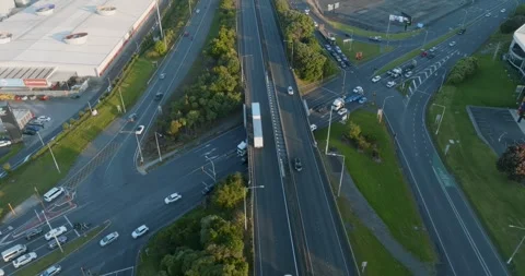 High-angle view of busy highway intersections, parking lots, and buildings. MT 스톡 동영상 296037106