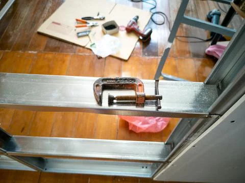High angle view, C-clamp, placed on Galvanized frame. Fotos de archivo
