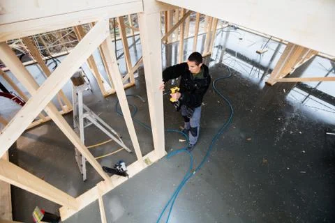 High Angle View Of Carpenter Drilling Wooden Plank Stock Photos