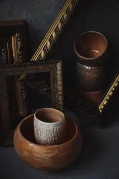 High angle view ceramic cup and bowl in picture frames like on painting Stock Photos
