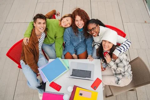 High angle view of a cheerful group of diverse students studying together a.. Stock Photos
