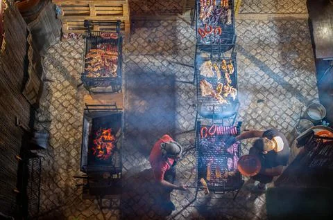 High angle view of chefs grilling meat at medieval fair Silves Portugal Foto stock