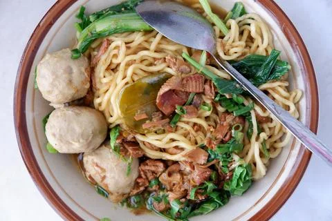High angle view of chicken noodle meatball (mie ayam bakso) with vegetables.. Stock Photos